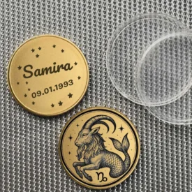 Beispiel einer personalisierten Sternzeichen Steinbock Münze mit Textgravur 'Samira 09.01.1993'.